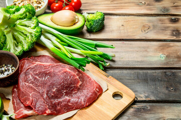 Healthy food. Variety of organic food with raw beef meat.