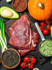 Healthy food. Organic food assortment with raw beef steaks .
