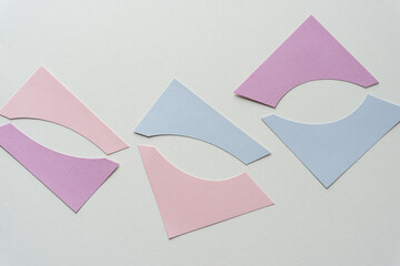 cut pastel card shapes on blank paper