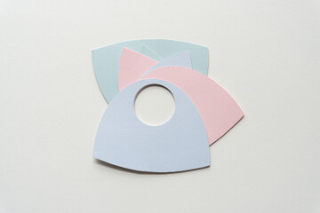 pastel card shapes with hole on blank paper