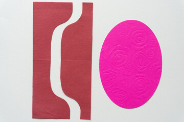 paper shape with wavy line and pink oval with floral embossed pattern