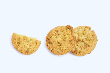 Pistachio and almond cookies on white background.