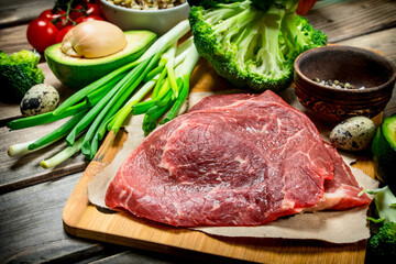 Healthy food. Variety of organic food with raw beef meat.