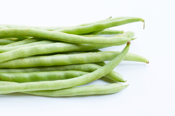 Green beans on white background.