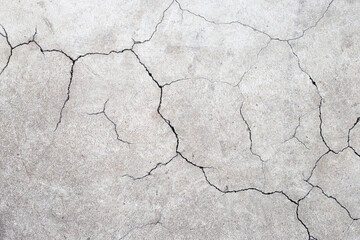 Cracked cement or concrete surface texture for background.