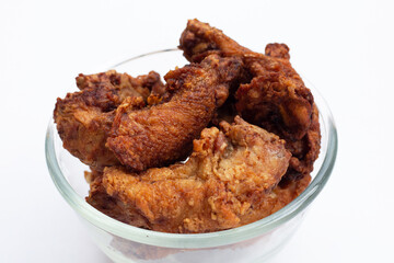 Fried chicken necks on white background.