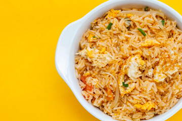 Fried rice on yellow background.