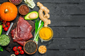 Healthy food. Organic food assortment with raw beef steaks .