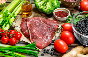 Healthy food. Variety of organic food with raw beef meat.
