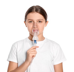 Cute girl using nebulizer for inhalation on white background