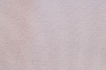 Abstract beige watercolor painting as background, top view