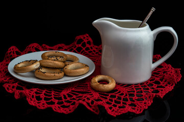 Still life with milk jar and bagels