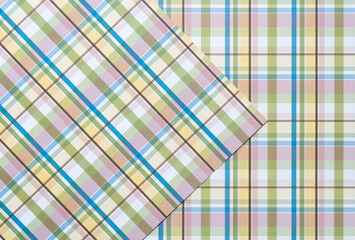 plaid pink yellow blue and green scrapbook paper background