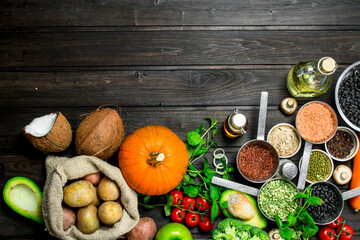 Fototapeta na wymiar Organic food. Healthy assortment of vegetables and fruits with legumes.