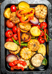 Different grilled vegetables with herbs and spices.