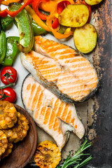 Grilled salmon steaks with vegetables.