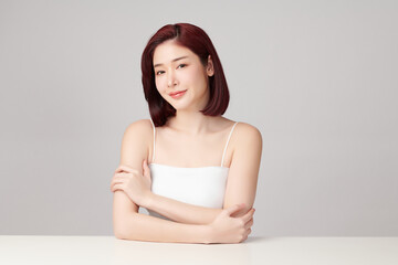 Fototapeta premium Beautiful young asian woman with clean fresh skin on grey background, Face care, Facial treatment, Cosmetology, beauty and spa, Asian women portrait.