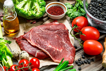 Healthy food. Variety of organic food with raw beef meat.