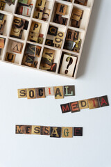 social media message and chipboard tiles displaying vintage style letters
