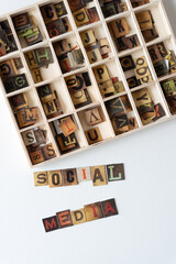 social media and chipboard tiles displaying vintage style letters