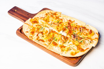tart flambe seafood pizza on wood board