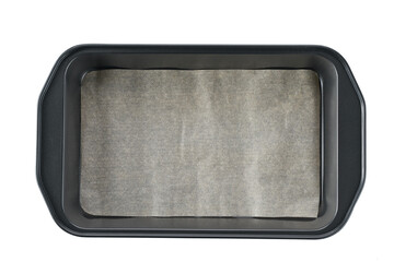 Baking sheet with brown parchment paper isolated on a white background.