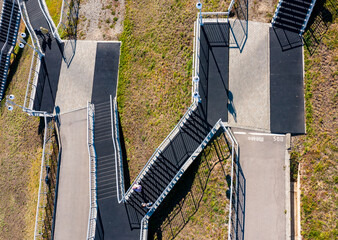 geometry of roads in the form of a serpentine, an asphalt road on a hill, design blanks of the shape view from a drone