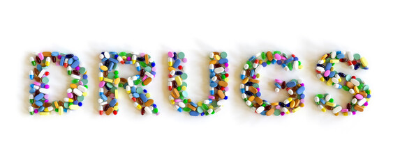 Close up Group of 3D Rendered Medicine Pills Arranged to Form the Word Drugs, Isolated on White Background