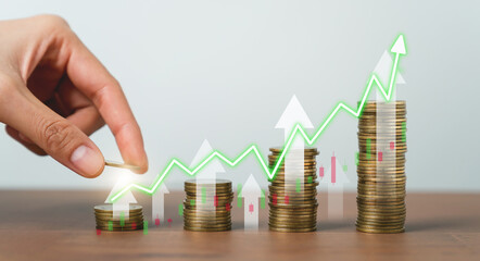 Hand putting coins on stack with show stock market graph and investment and currency exchange. concept saving money and financial growth.