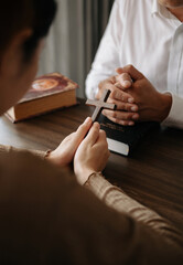 Christians are congregants join hands to pray and seek the blessings of God...