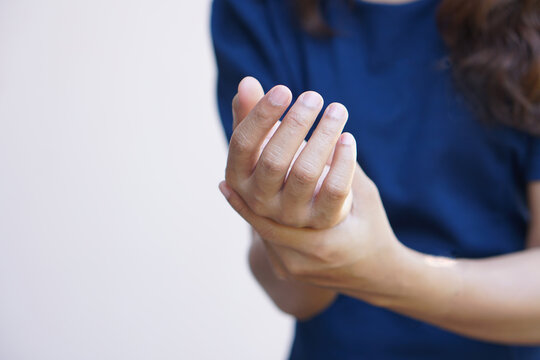 Asian Female Hands Have Weakness From Office Work