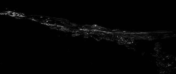 Liquid suface line between underwater and above water with black background. Show water bubble...