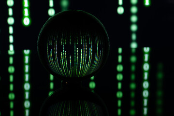Dark background with computer binary code and a ball. The concept of artificial intelligence. Computer technology