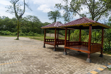 Wooden gazebo to relax in the middle of a city park