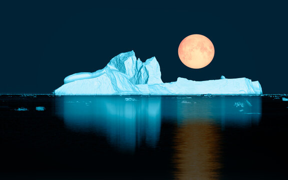 Melting icebergs by the coast of Greenland with Full moon over the sea - Greenland "Elements of this image furnished by NASA"