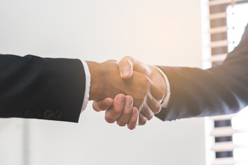 Support, business people, happy asian young man in suit, making handshake, shake hand together with...