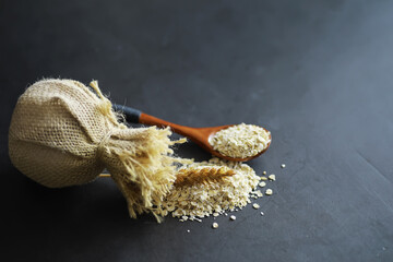 World grain crisis. A handful of cereals and on a dark background.