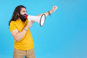 Man protesting while shouting with a loudspeaker