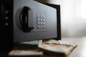 money in a residential safe close-up photo. Deposit in cash. Russian rubles are in the safe