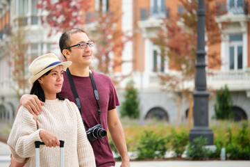 Fototapeta premium Multiracial couple of tourists exploring the city together.