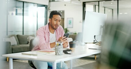 Asian man, eating apple and desk in office for lunch time snack, relax planning strategy on pc and checking phone. Businessman, reading smartphone communication and eat healthy food for nutrition - Powered by Adobe