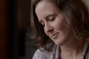 Fototapeta premium S. having a quiet moment by the window in a cozy café.