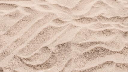 Naklejka na ściany i meble Sand texture closeup. Sand backgound.