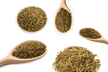 Oregano spice in wooden spoon isolated.