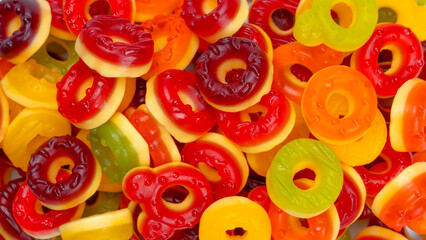 Fototapeta na wymiar Assorted colorful gummy candies. Jelly donuts. Jelly bears.