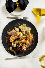 grilled seafoods with lemon and sauce