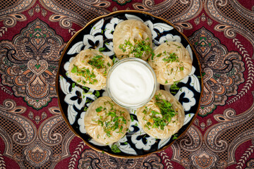 Traditional manti food on plate, top view.
