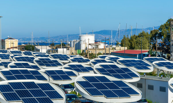 solar power plant with big antennas on a parking for charging electrocars, car energy of future