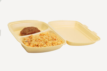 Cutlet and rice in a plastic box for delivery.