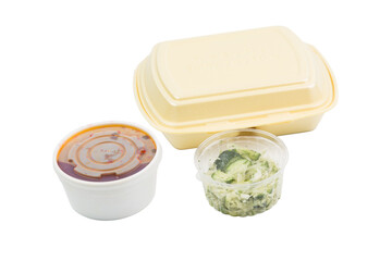 Food plastic box, sauce and salad.